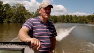 Troy Landry at work hunting alligators in the Louisiana swamps